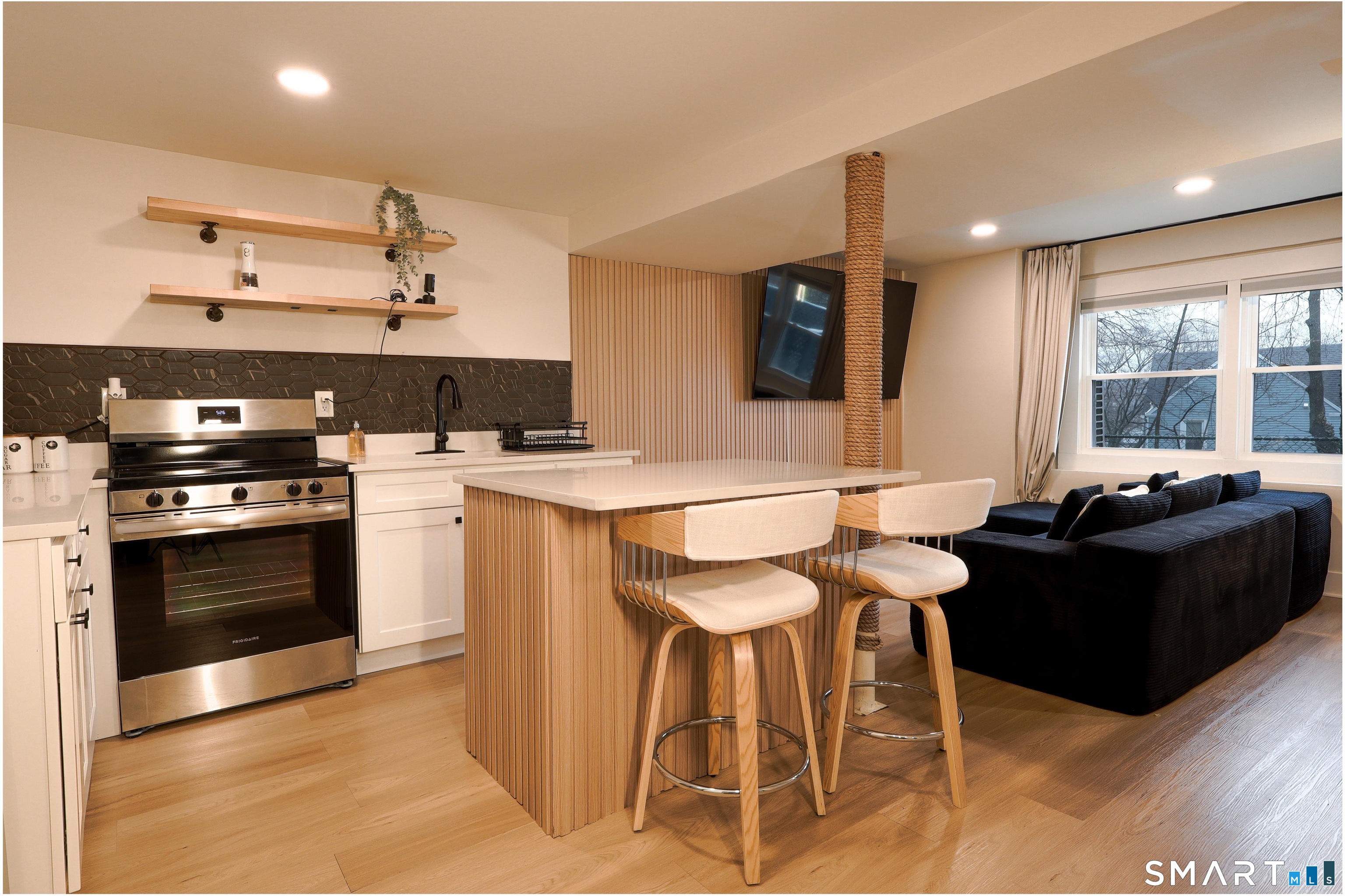 233 Glenbrook Road Stamford, CT 06906 - Photo 13 of 20 a kitchen with a stove a sink and a refrigerator