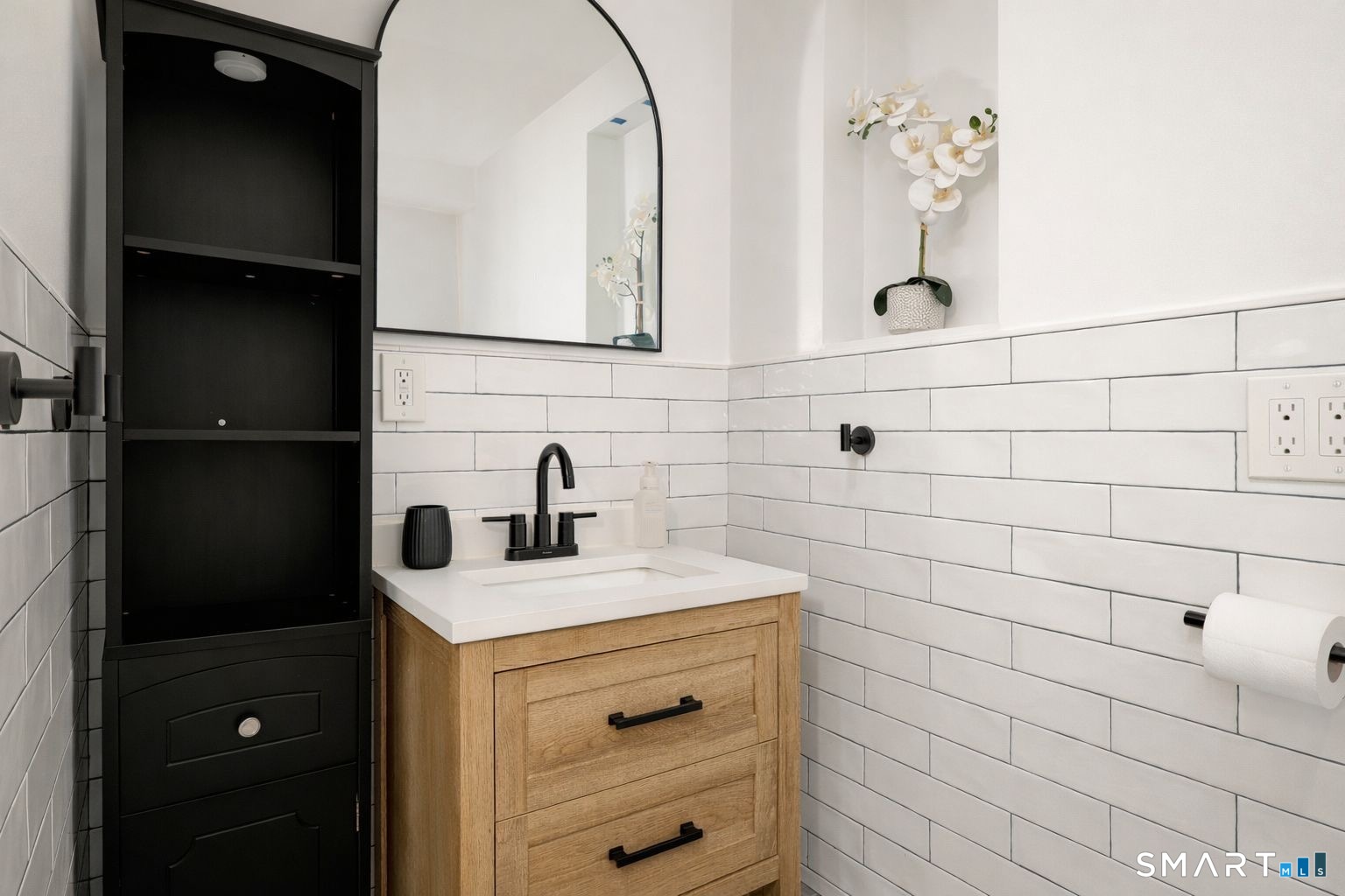 233 Glenbrook Road Stamford, CT 06906 - Photo 14 of 20 a bathroom with a sink and a mirror