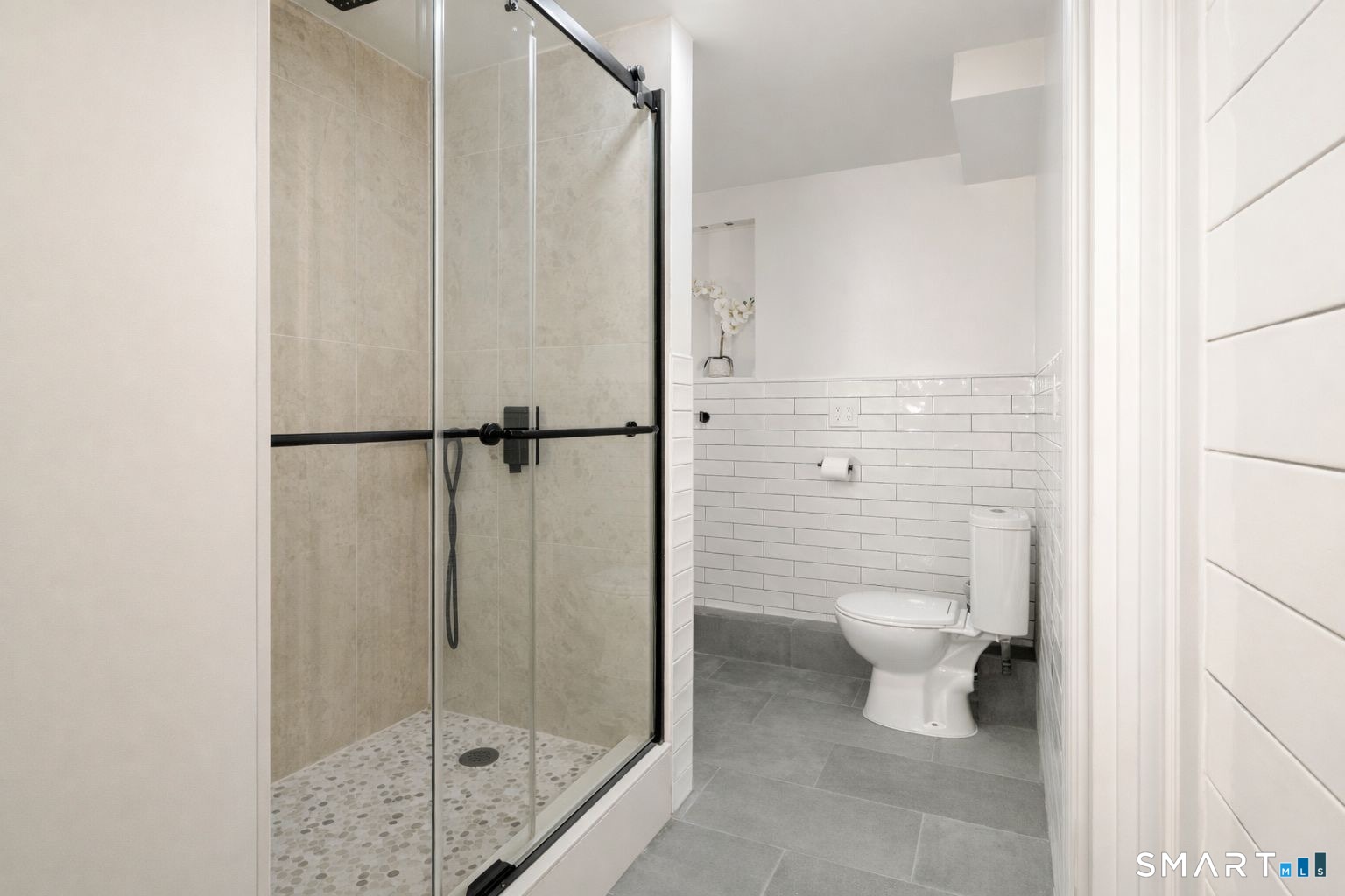 233 Glenbrook Road Stamford, CT 06906 - Photo 15 of 20 a bathroom with a toilet and a shower