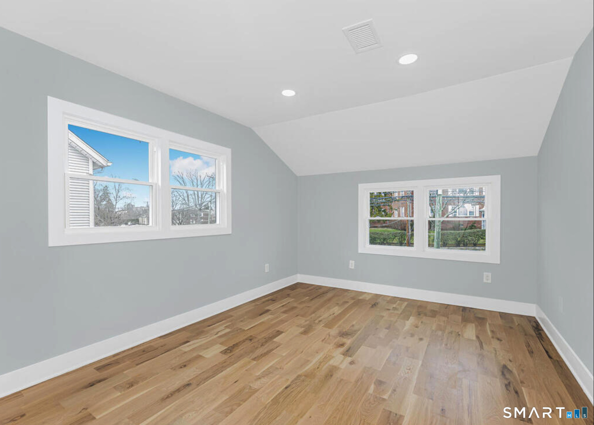 233 Glenbrook Road Stamford, CT 06906 - Photo 5 of 20 a view of empty room with wooden floor and fan