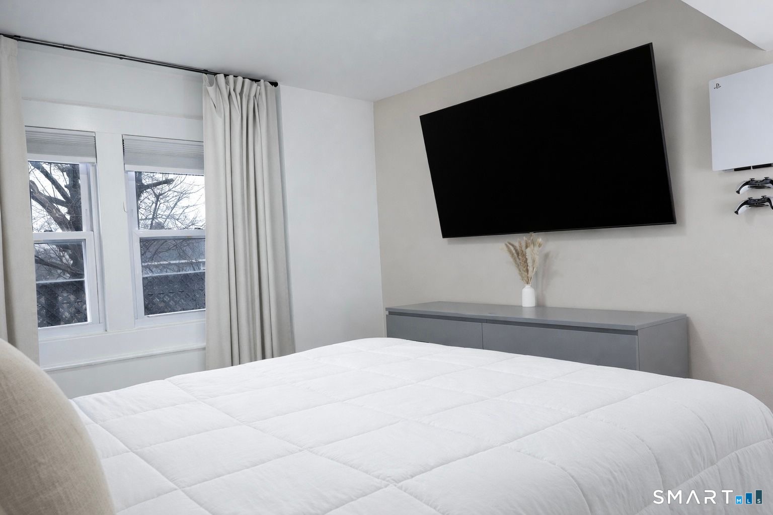 233 Glenbrook Road Stamford, CT 06906 - Photo 8 of 20 a bedroom with a flat screen tv and a view of bedroom