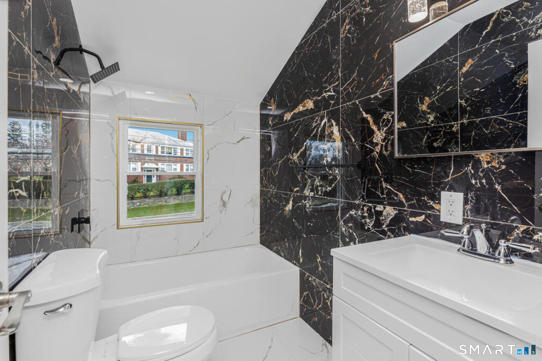233 Glenbrook Road Stamford, CT 06906 - Photo 9 of 20 a bathroom with a tub sink and mirror
