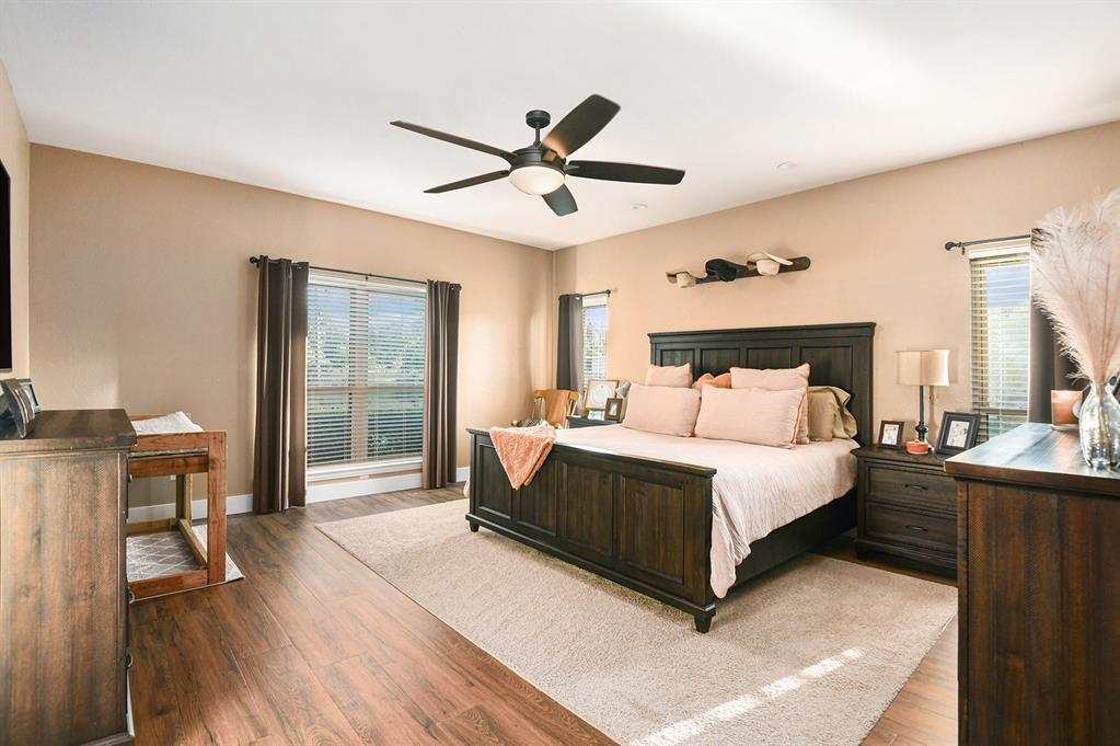 12384 J J Rendon Road Burleson, TX 76028 - Photo 16 of 31 a bed sitting in a spacious bedroom next to a window