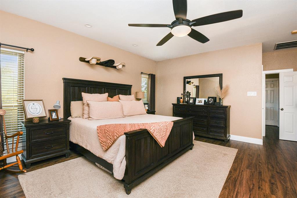 12384 J J Rendon Road Burleson, TX 76028 - Photo 17 of 31 a bedroom with a bed and wooden floor