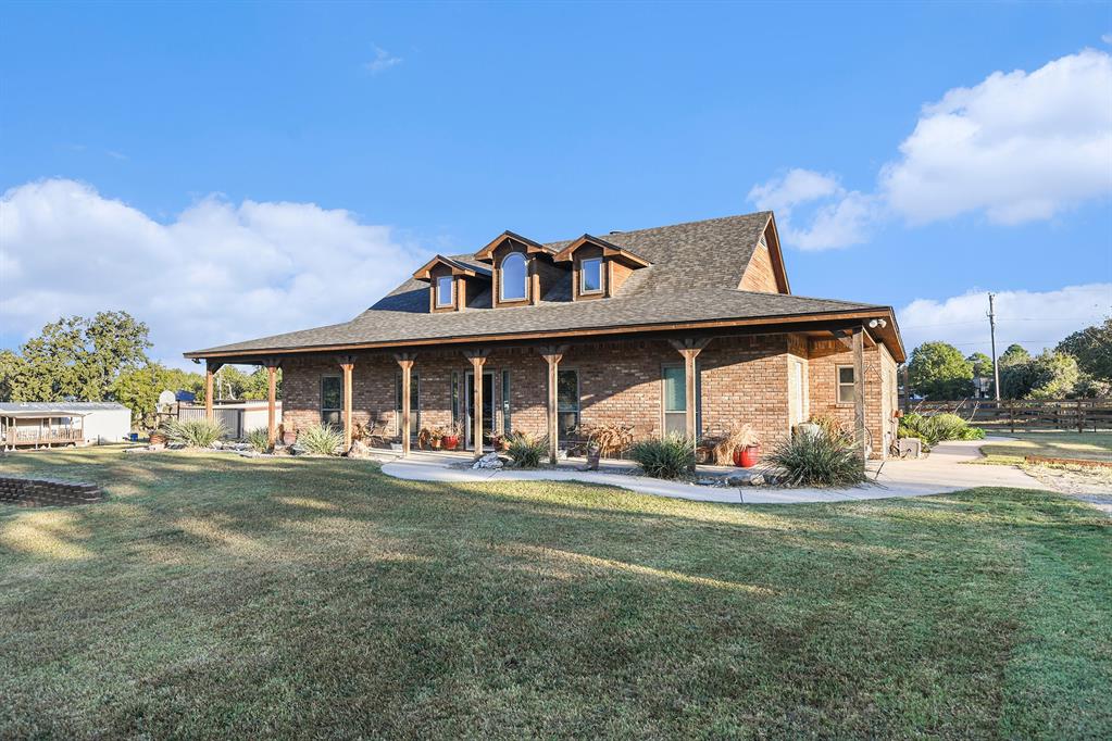 12384 J J Rendon Road Burleson, TX 76028 - Photo 2 of 31 a front view of a house with a yard