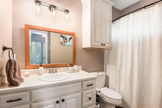 a bedroom with a bed and a desk