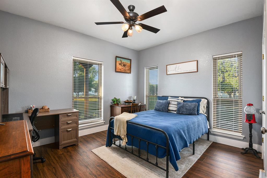 12384 J J Rendon Road Burleson, TX 76028 - Photo 23 of 31 a bedroom with a bed and a desk