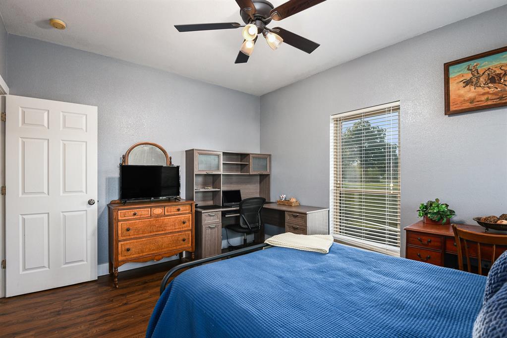 12384 J J Rendon Road Burleson, TX 76028 - Photo 24 of 31 a bedroom with furniture and wooden floor
