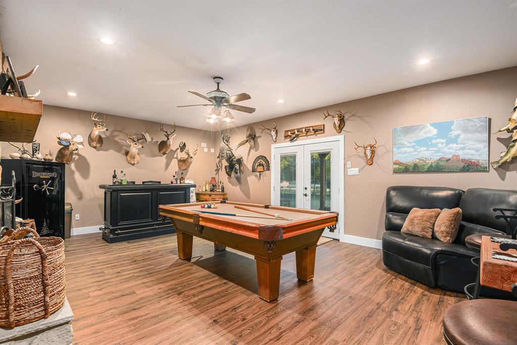 12384 J J Rendon Road Burleson, TX 76028 - Photo 26 of 31 a view of a livingroom with furniture and a flat screen tv