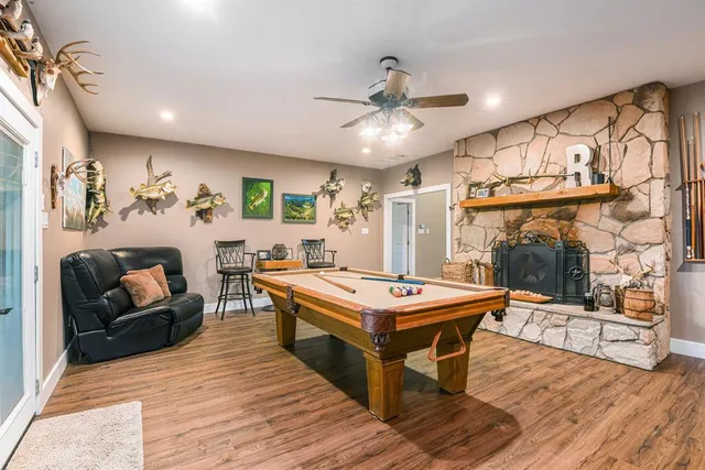 a patio with glass top table and chairs