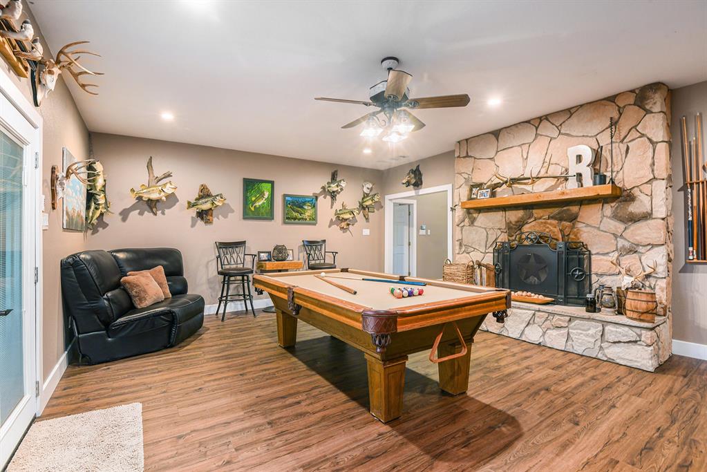12384 J J Rendon Road Burleson, TX 76028 - Photo 28 of 31 a living room with stainless steel appliances kitchen island granite countertop furniture and a fireplace