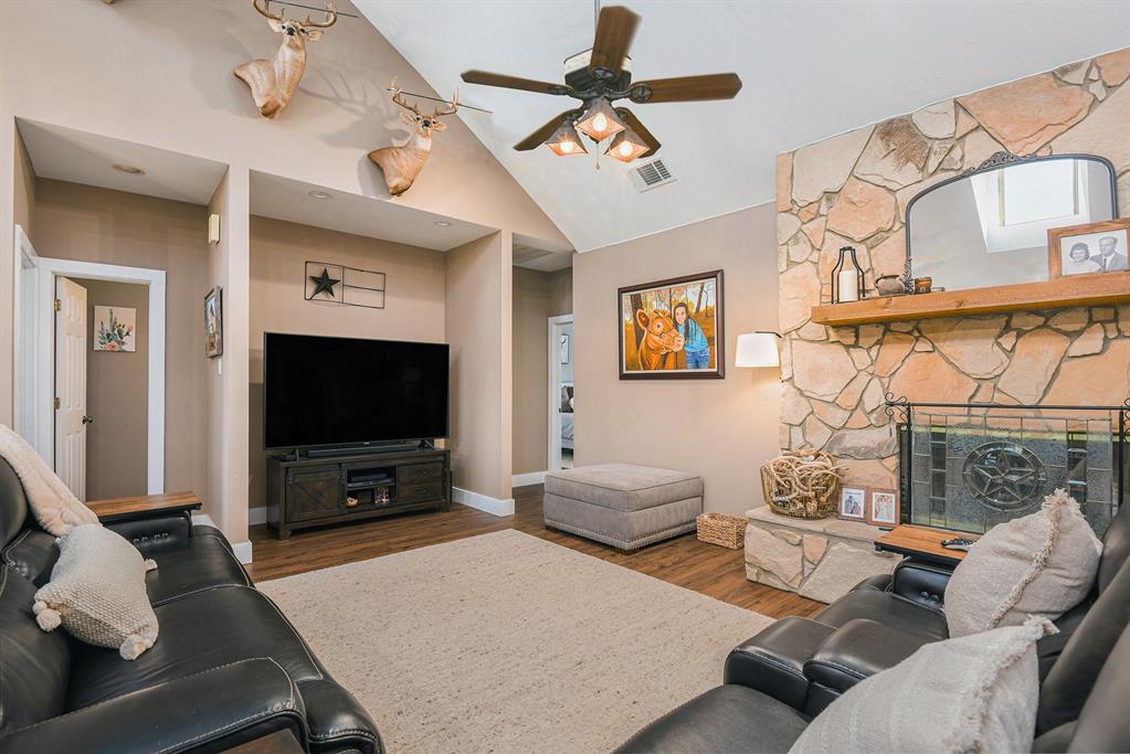 12384 J J Rendon Road Burleson, TX 76028 - Photo 4 of 31 a living room with furniture and a flat screen tv