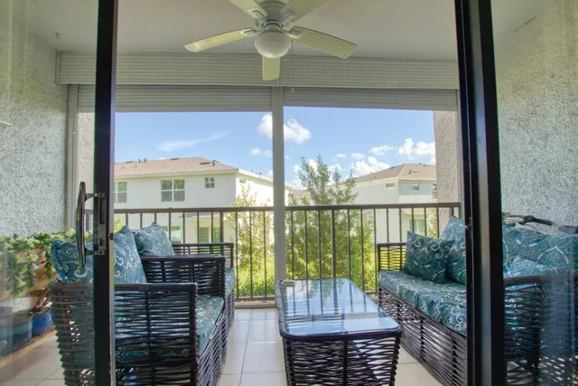 a view of a balcony with wooden floor