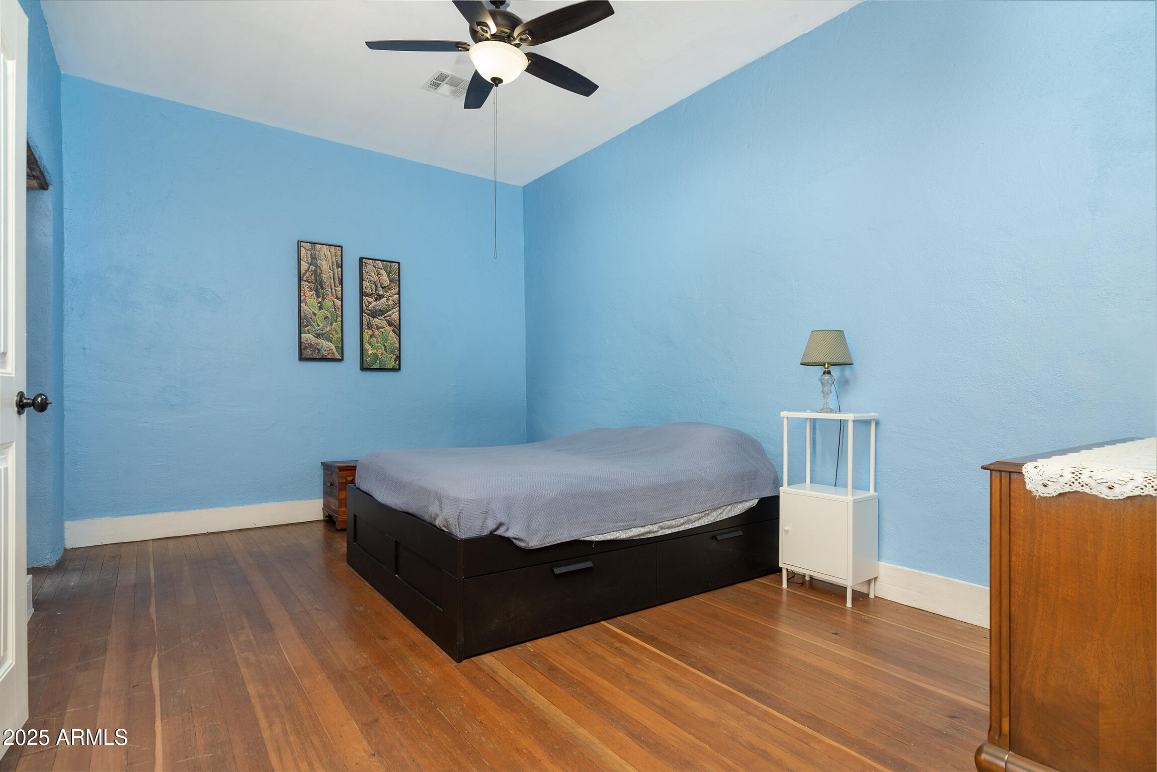 321 Bailey Street Florence, AZ 85132 - Photo 19 of 67 a bedroom with a bed and wooden floor