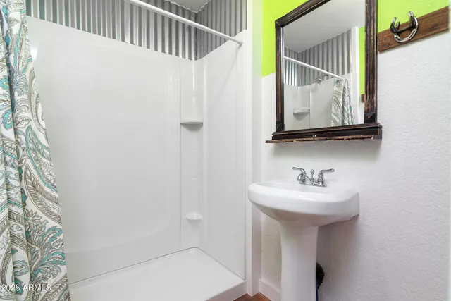 a bathroom with a bathtub and shower