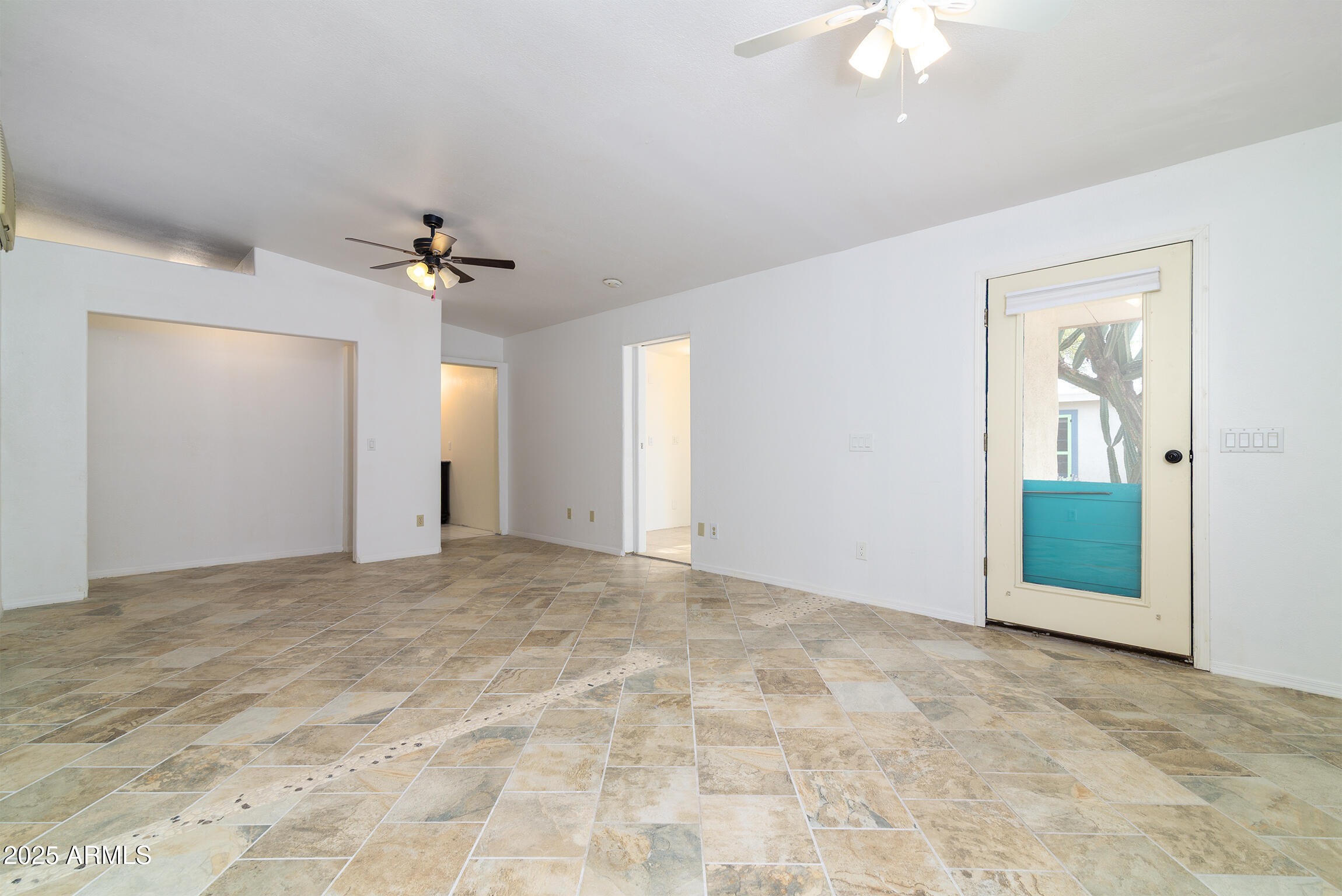 321 Bailey Street Florence, AZ 85132 - Photo 30 of 67 a view of an empty room with a chandelier fan