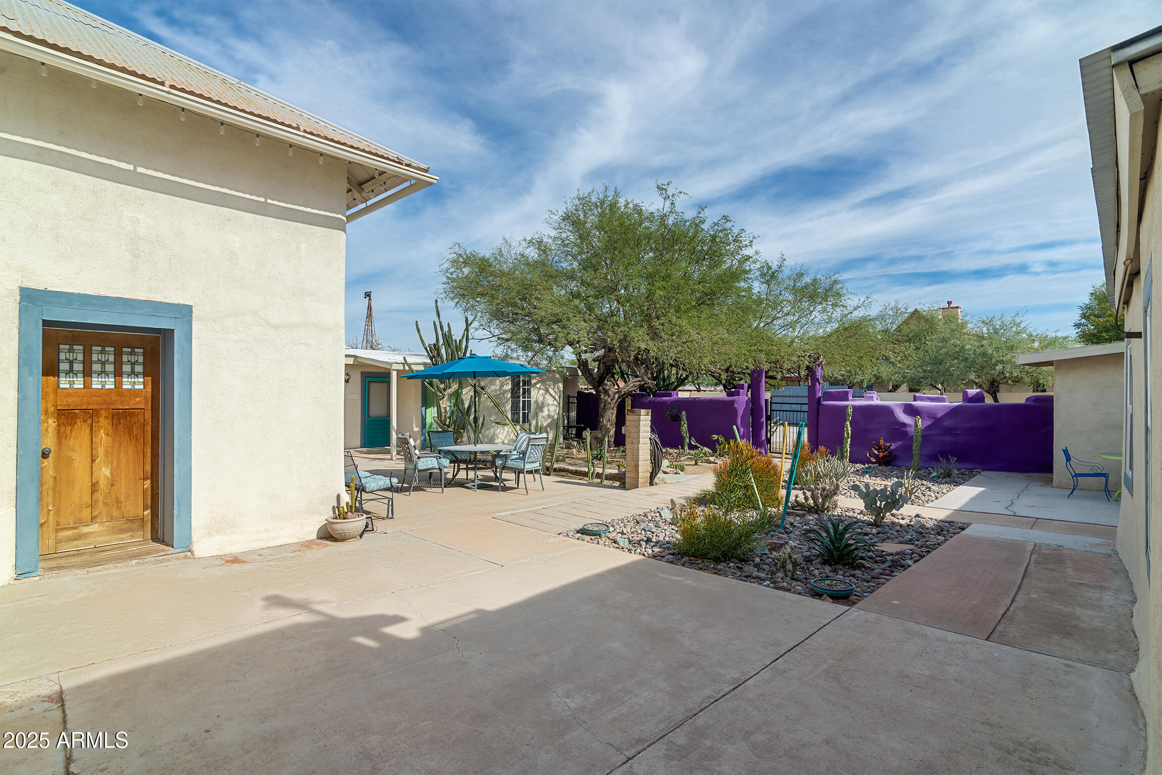 321 Bailey Street Florence, AZ 85132 - Photo 36 of 67 a view of a chairs with potted plants in front of house