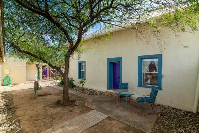 a backyard of a house with a yard and garage