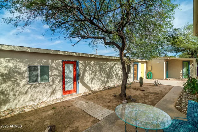 a view of the house with a yard