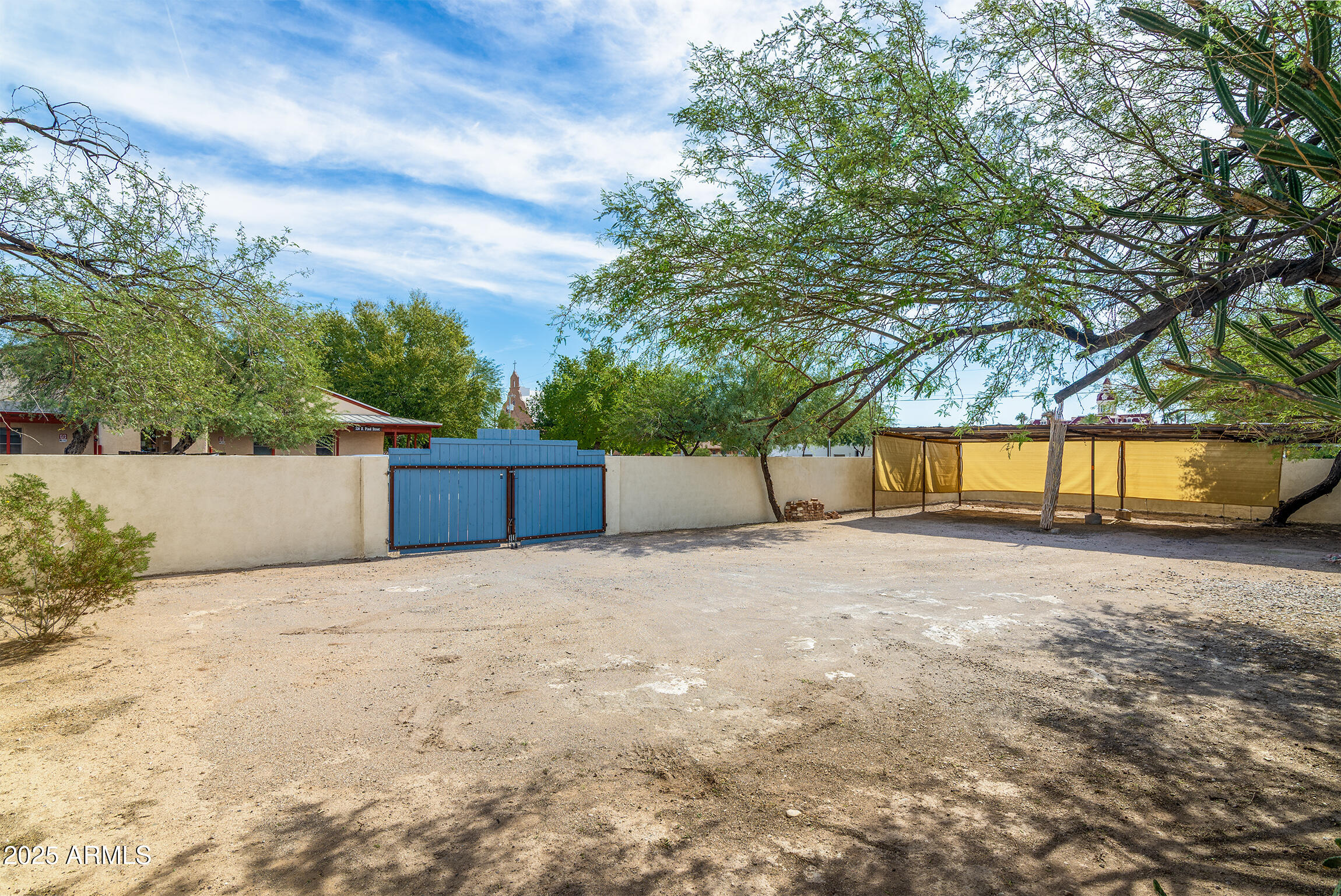 321 Bailey Street Florence, AZ 85132 - Photo 50 of 67 a backyard of a house with a yard and garage