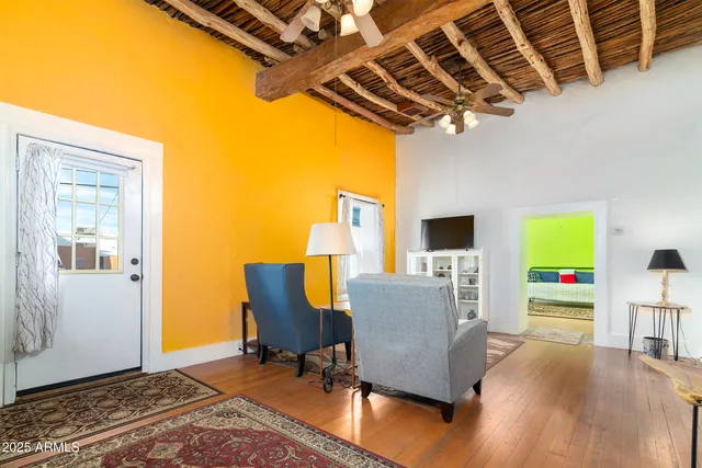 a living room with furniture and a rug