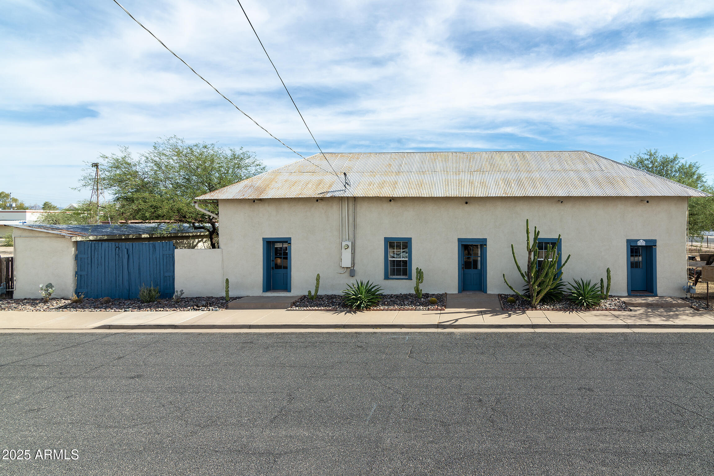 321 Bailey Street Florence, AZ 85132 - Photo 65 of 67 a front view of a house with a road