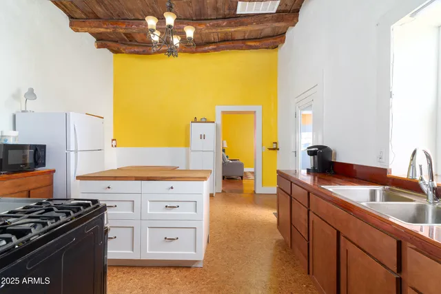 a kitchen with a stove and a sink