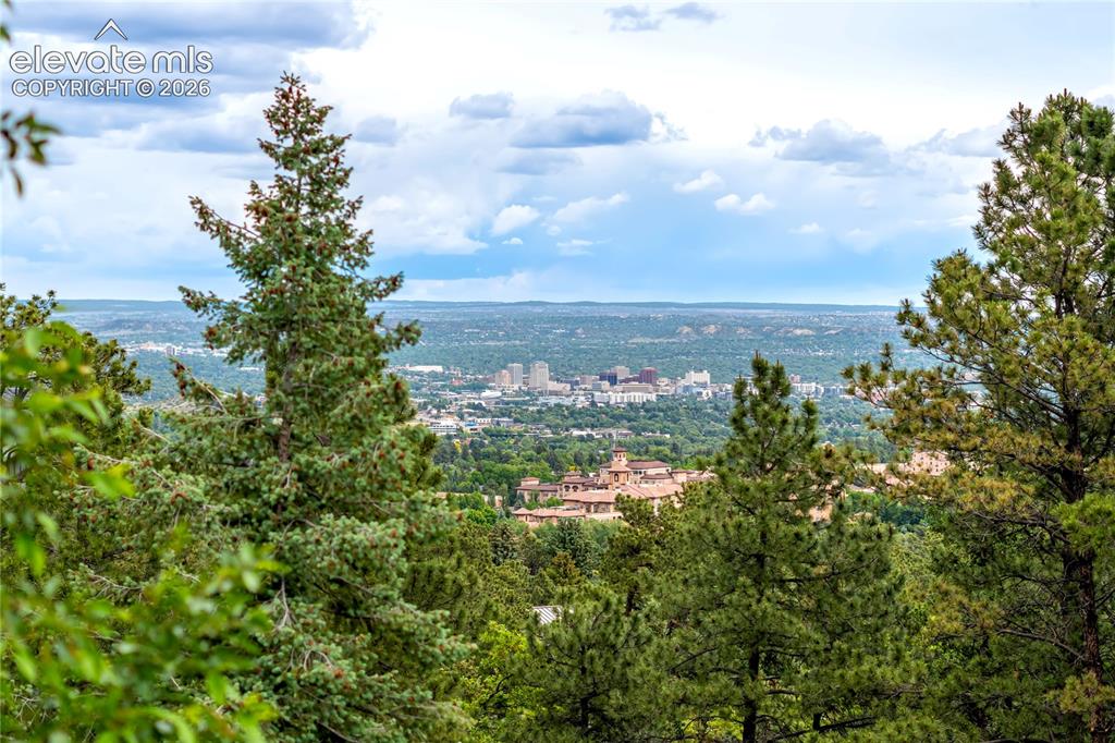 3 Thayer Road Colorado Springs, CO 80906 - Photo 50 of 50 Surrounded by towering pines and backed by iconic Cheyenne Mountain, this remarkable setting offers privacy, beauty, and a true sense of place.