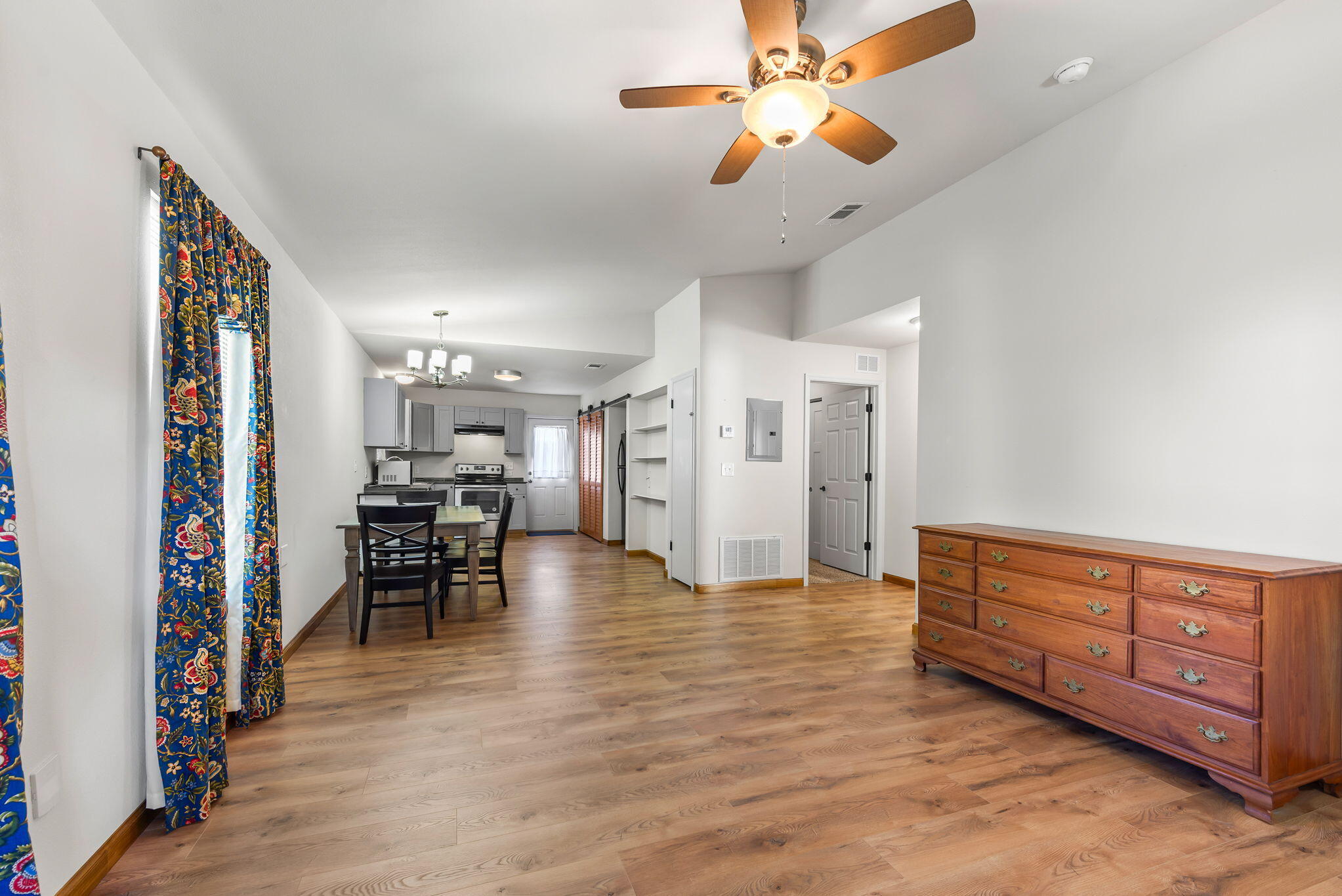 8528 Laredo Street Navarre, FL 32566 - Photo 5 of 16 a view of a livingroom with furniture and a ceiling fan