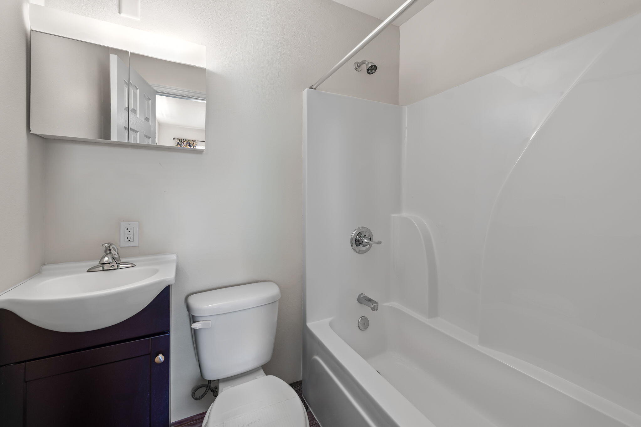 8528 Laredo Street Navarre, FL 32566 - Photo 9 of 16 a bathroom with a sink toilet and shower