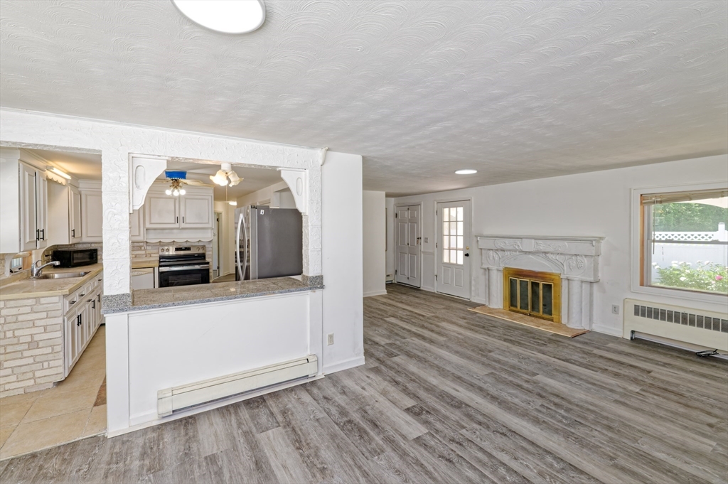 1 Rockland Rd Court Auburn, MA 01501 - Photo 11 of 38 a view of a living room with furniture and fireplace