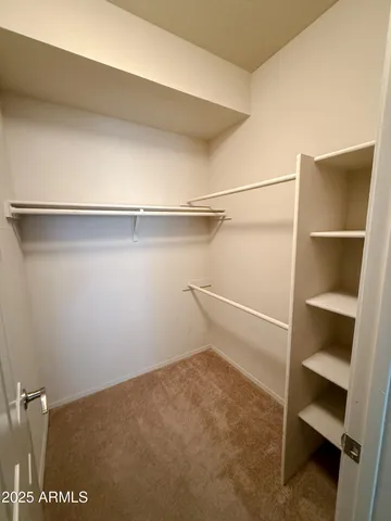 a view of an empty walk in closet