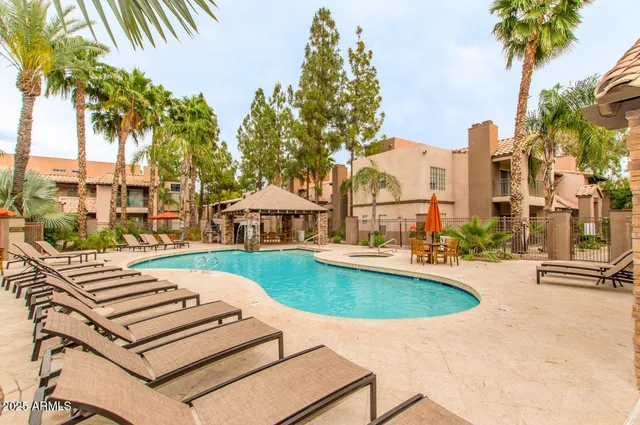 a view of a swimming pool with a patio