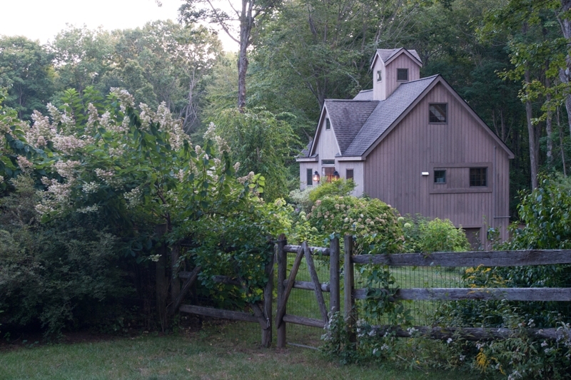 61 Hopewell Woods Road Redding, CT 06896 - Photo 12 of 22 a view of a house with a yard