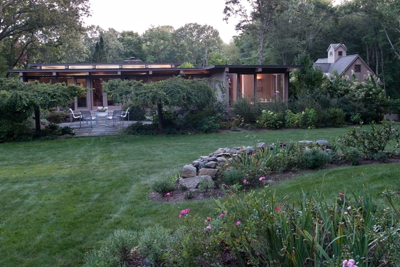61 Hopewell Woods Road Redding, CT 06896 - Photo 2 of 22 a front view of a house with garden