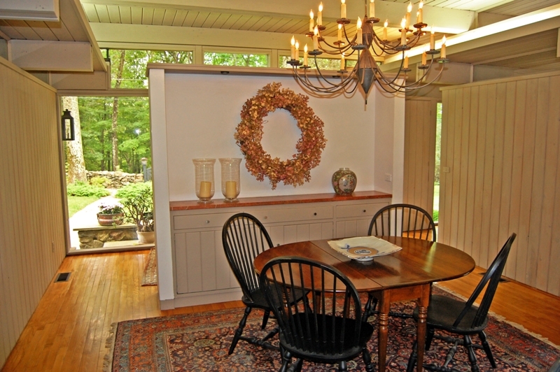 61 Hopewell Woods Road Redding, CT 06896 - Photo 5 of 22 a view of a dining room with furniture window and outside view