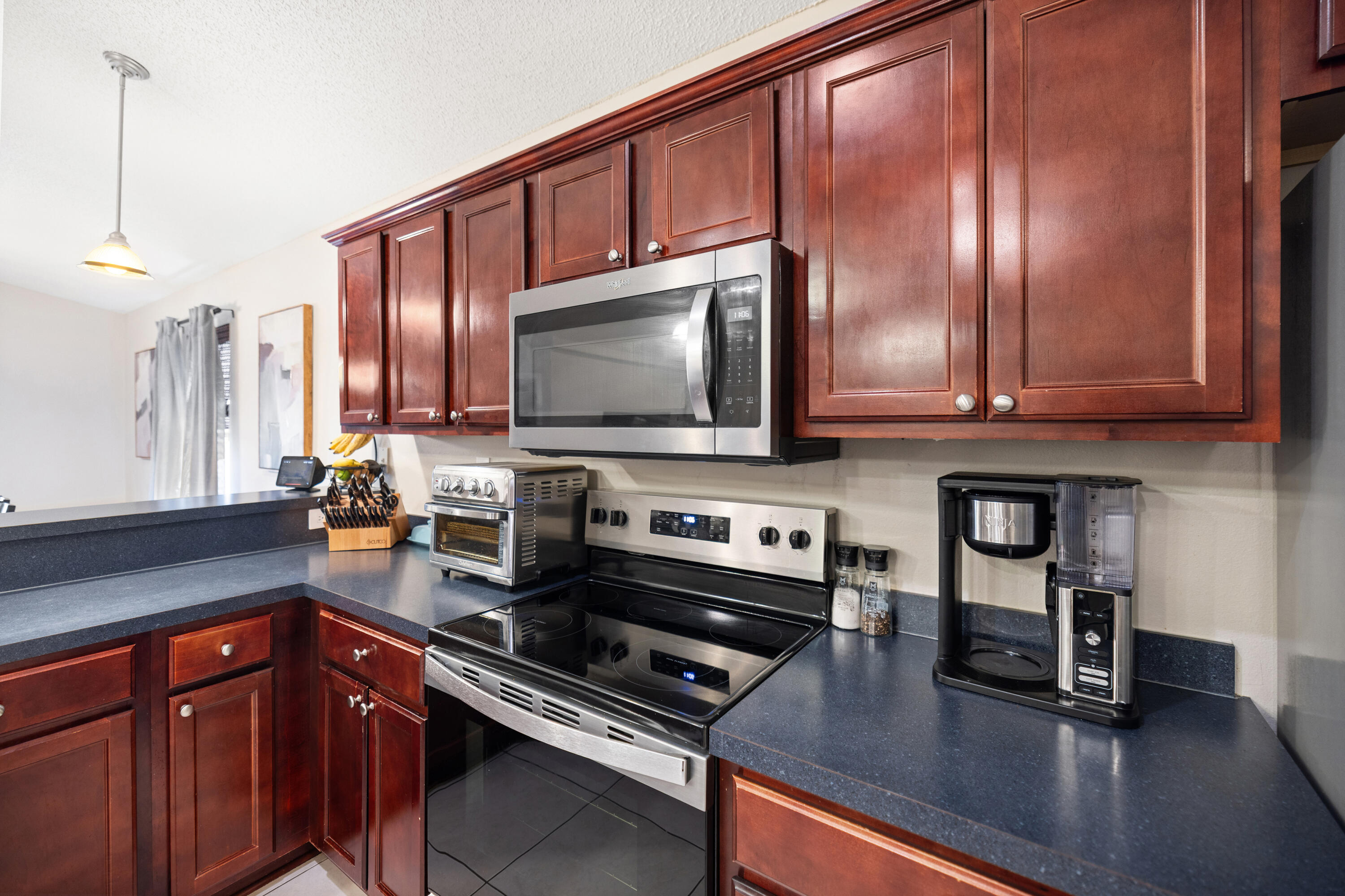 202 Limestone Circle Crestview, FL 32539 - Photo 13 of 49 a kitchen with stainless steel appliances a sink a stove and cabinets