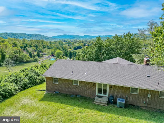 an aerial view of a house with a garden