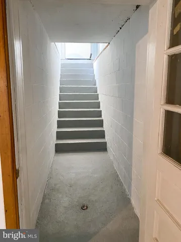 a view of a closet area with empty racks