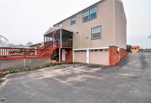 a view of a house with wooden fence