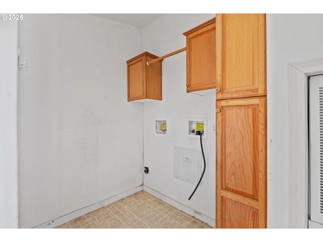 a view of a room with wooden walls