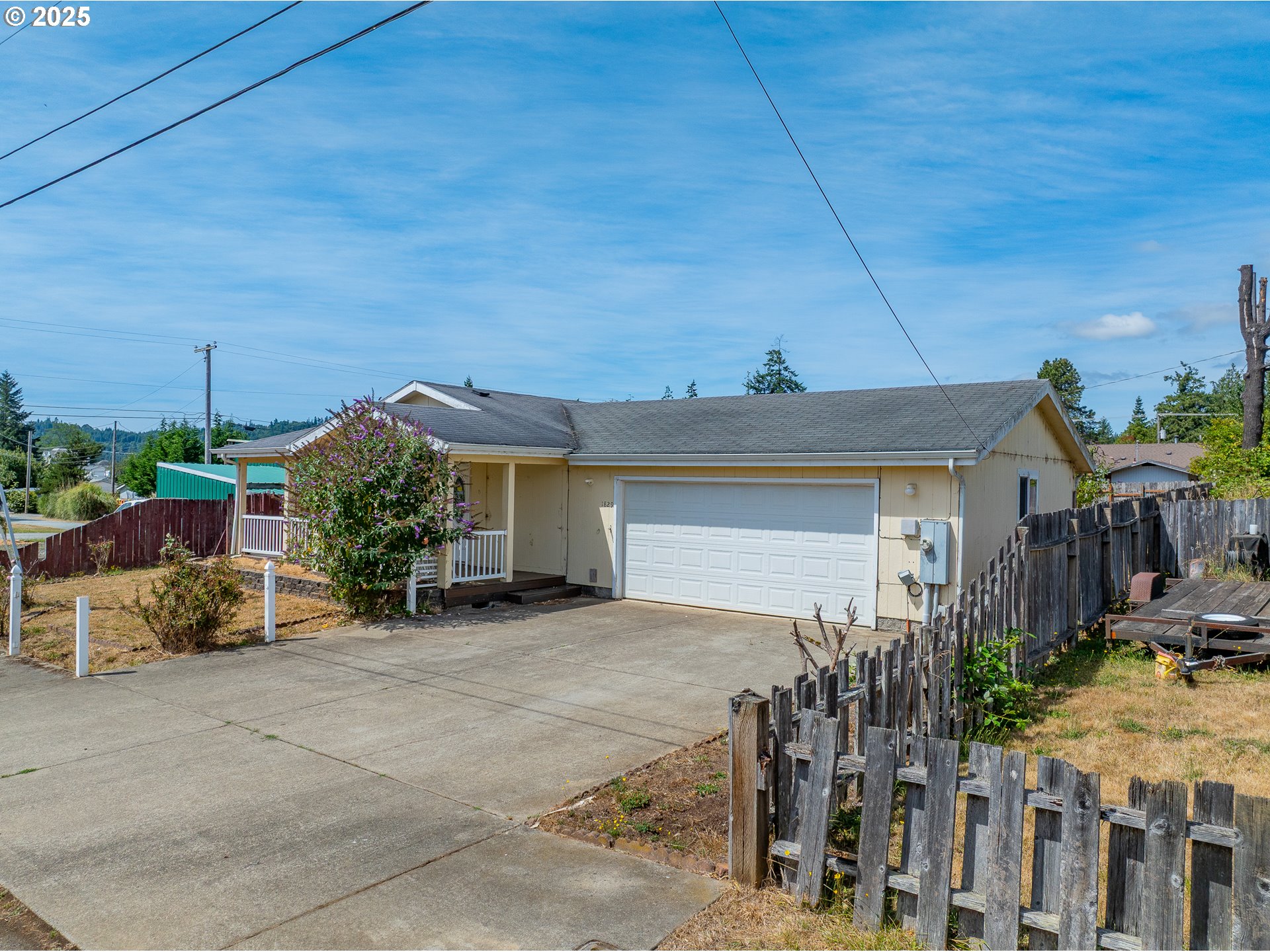 1829 East Willow Street Myrtle Point, OR 97458 - Photo 3 of 37 a view of a house with backyard and plants
