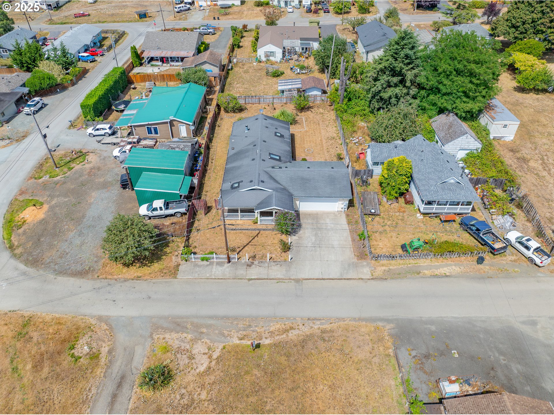1829 East Willow Street Myrtle Point, OR 97458 - Photo 37 of 37 an aerial view of a house with a garden