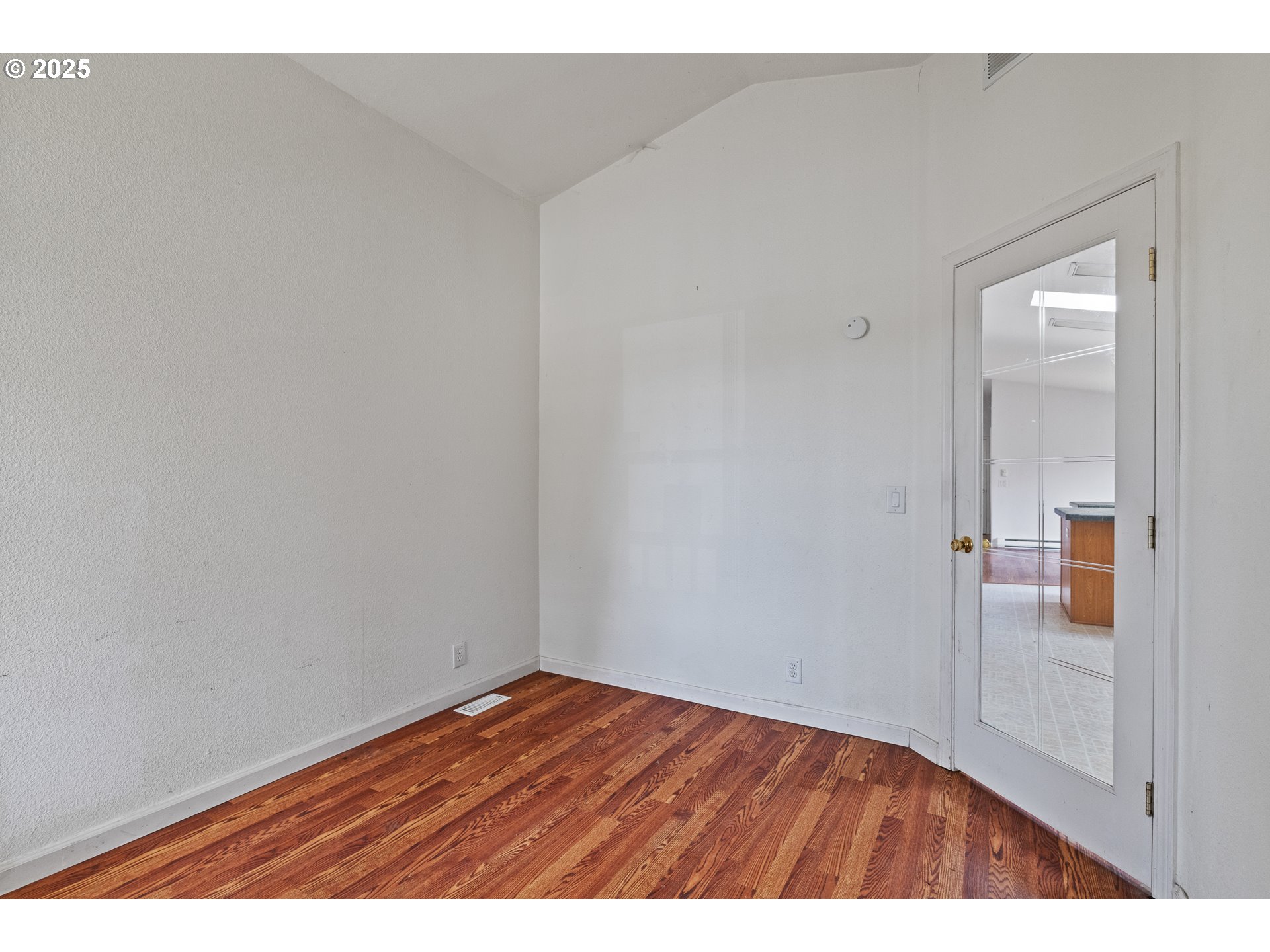 1829 East Willow Street Myrtle Point, OR 97458 - Photo 6 of 37 a view of an empty room and wooden floor