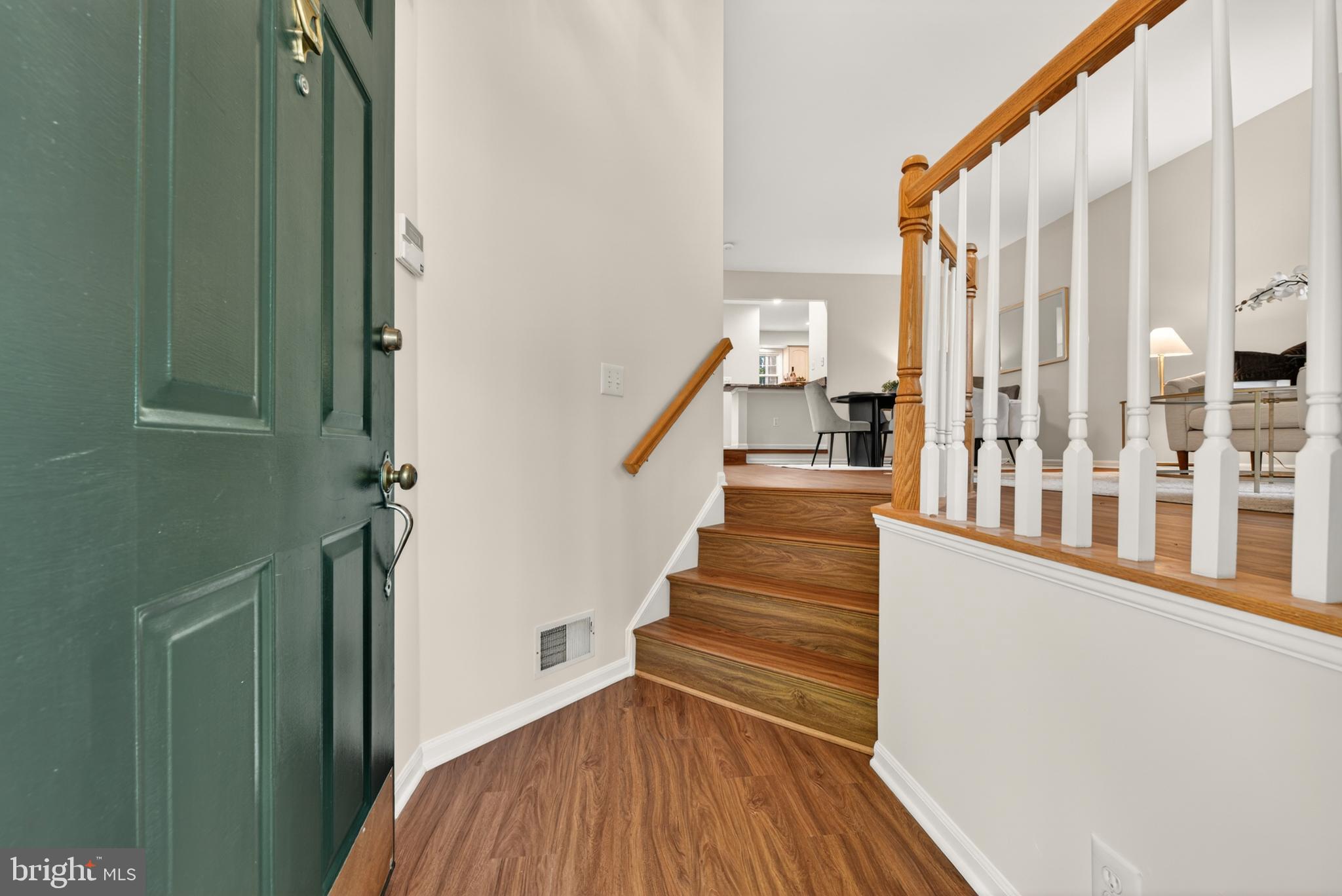 1409 Park Garden Lane Reston, VA 20194 - Photo 4 of 41 a view of a balcony with wooden floor and staircase