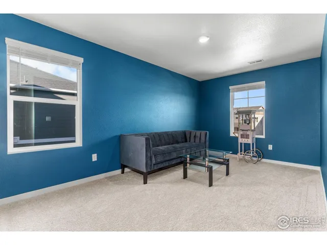 a living room with furniture and window