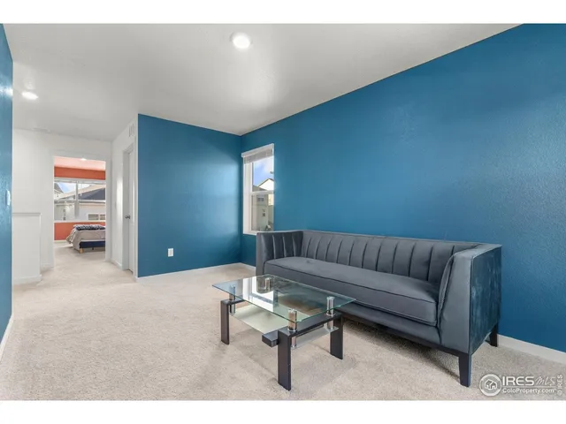 a living room with furniture and a rug