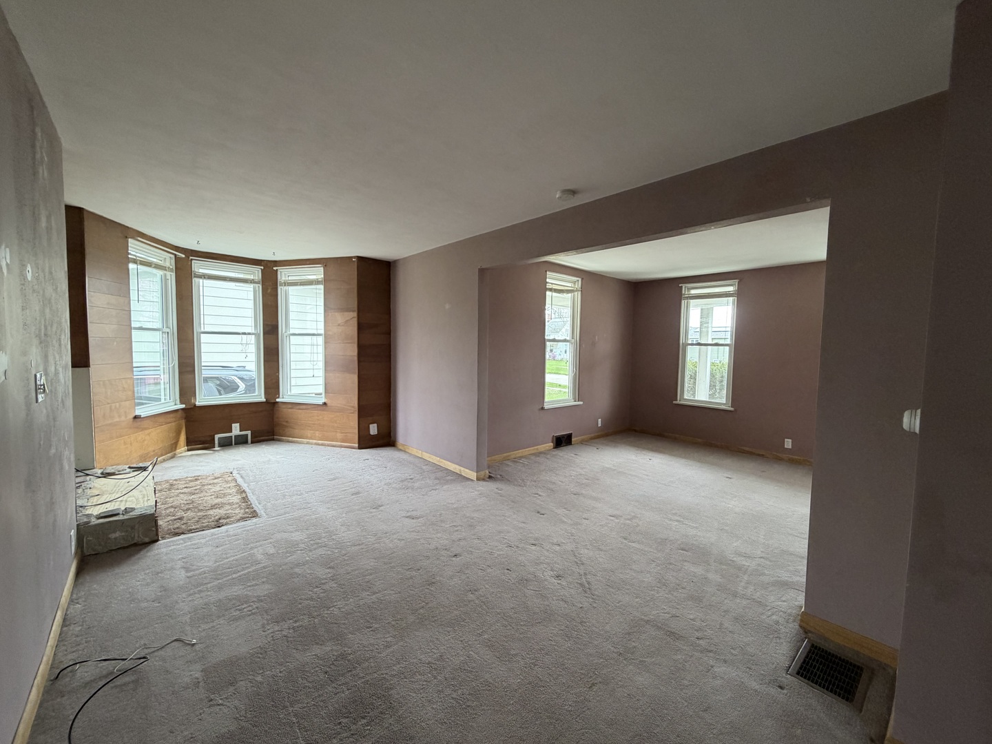 616 East Main Street Amboy, IL 61310 - Photo 12 of 24 a view of a bedroom with a large bed and large windows