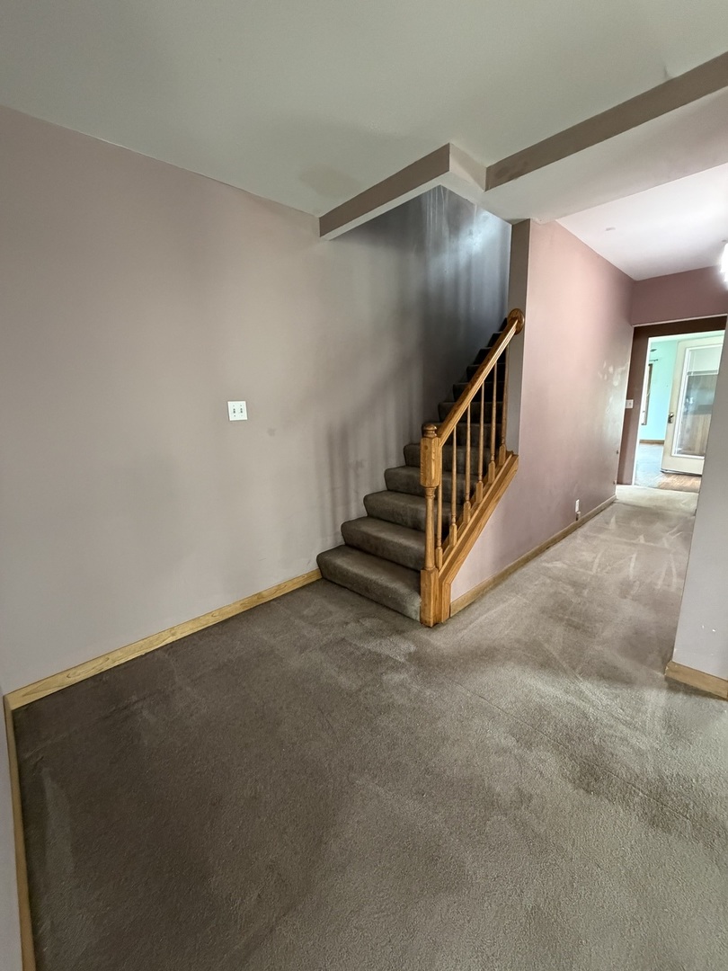 616 East Main Street Amboy, IL 61310 - Photo 15 of 24 a view of an empty room with stairs