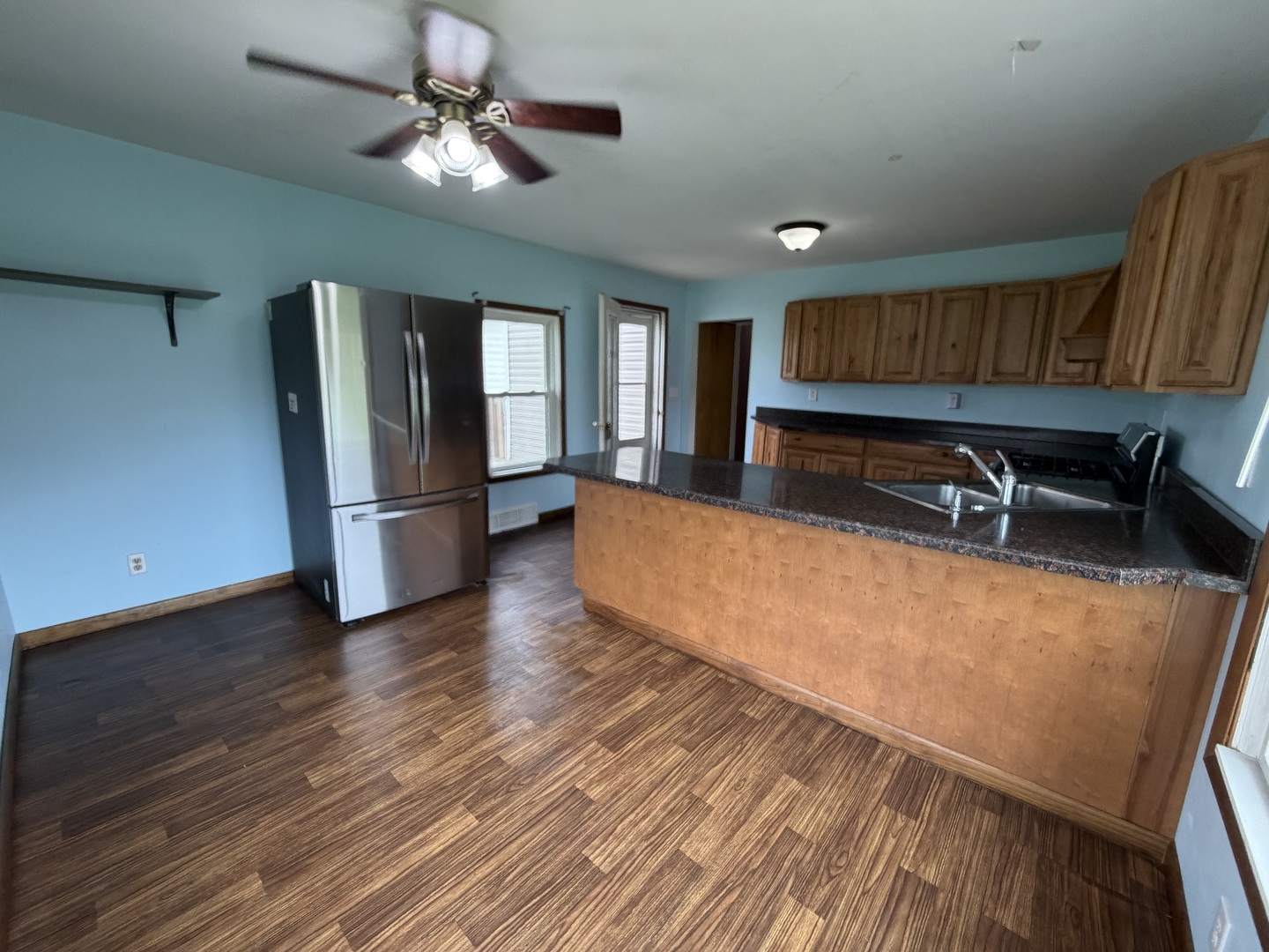 616 East Main Street Amboy, IL 61310 - Photo 21 of 24 a view of kitchen with cabinets and wooden floor